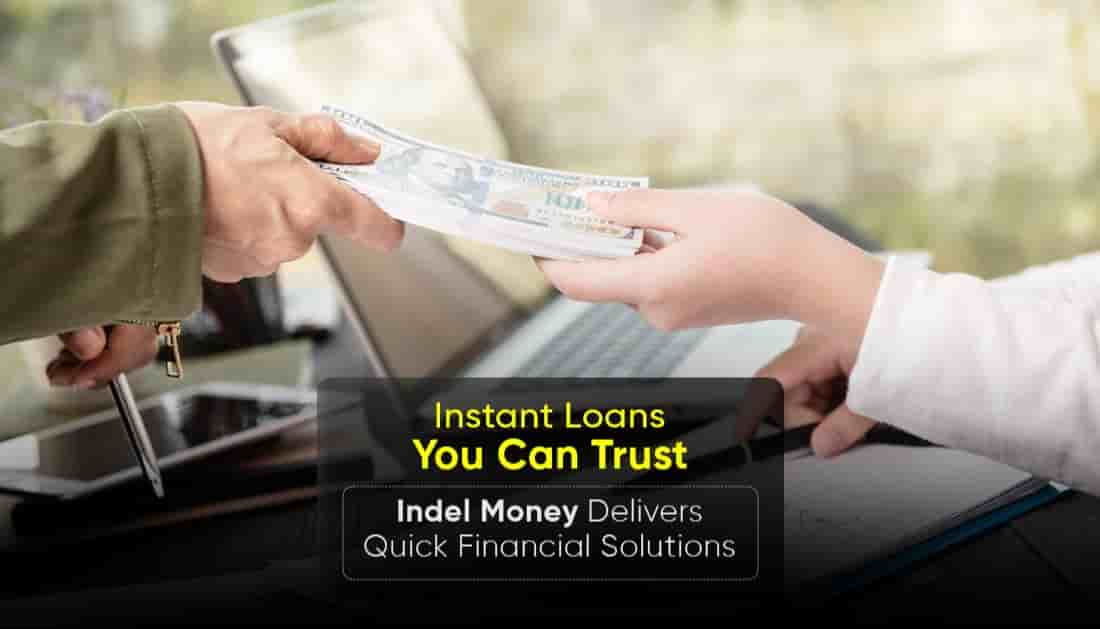 A person handing over cash to another person in an office setting, representing Indel Money’s quick and reliable instant loan services designed to provide fast financial solutions in India.