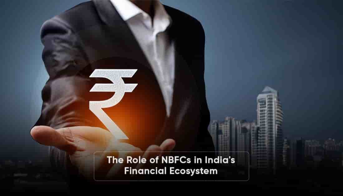 A businessman in a suit holding an illuminated Indian rupee symbol against a city skyline, representing the crucial role of NBFCs in strengthening India’s financial ecosystem and supporting economic growth.