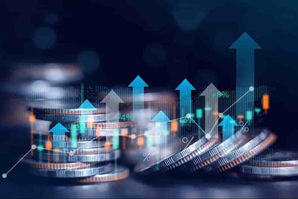 Stacked coins with upward arrows and financial growth indicators, representing stronger banks, improved liquidity, and easier access to credit under new economic measures.