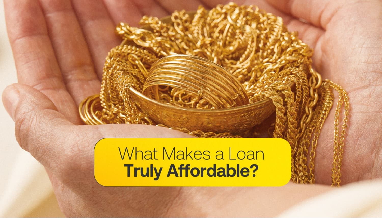 Hands holding gold jewellery with the text “What Makes a Loan Truly Affordable?”, illustrating loan affordability and gold loan financing options.