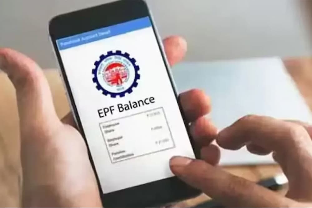 A person checking EPF balance on a smartphone, illustrating EPFO 3.0 modifications and new provident fund rules affecting employee savings in India.